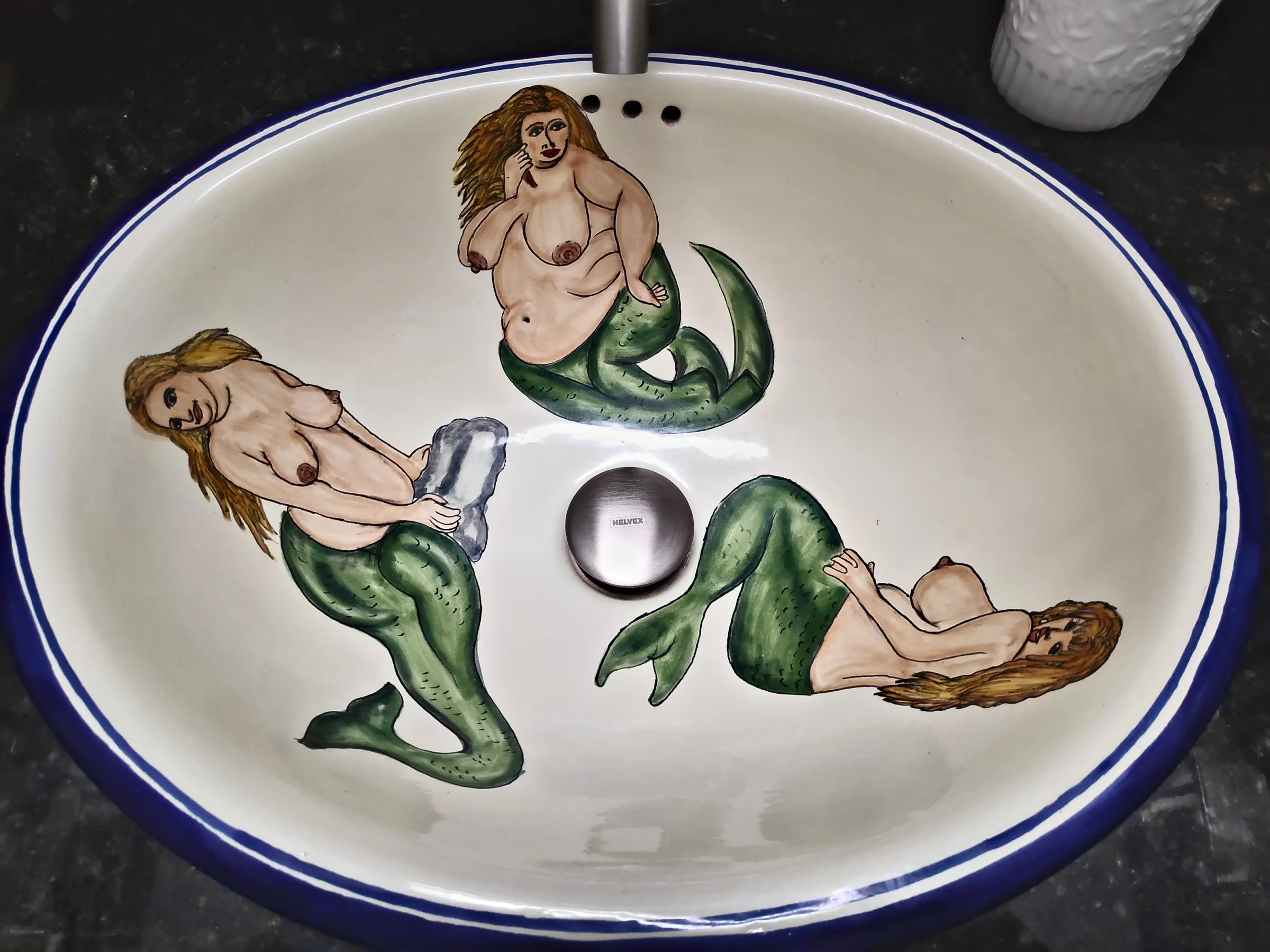 Hand-painted Talavera washbasin with three mermaids in the La Sirena suite