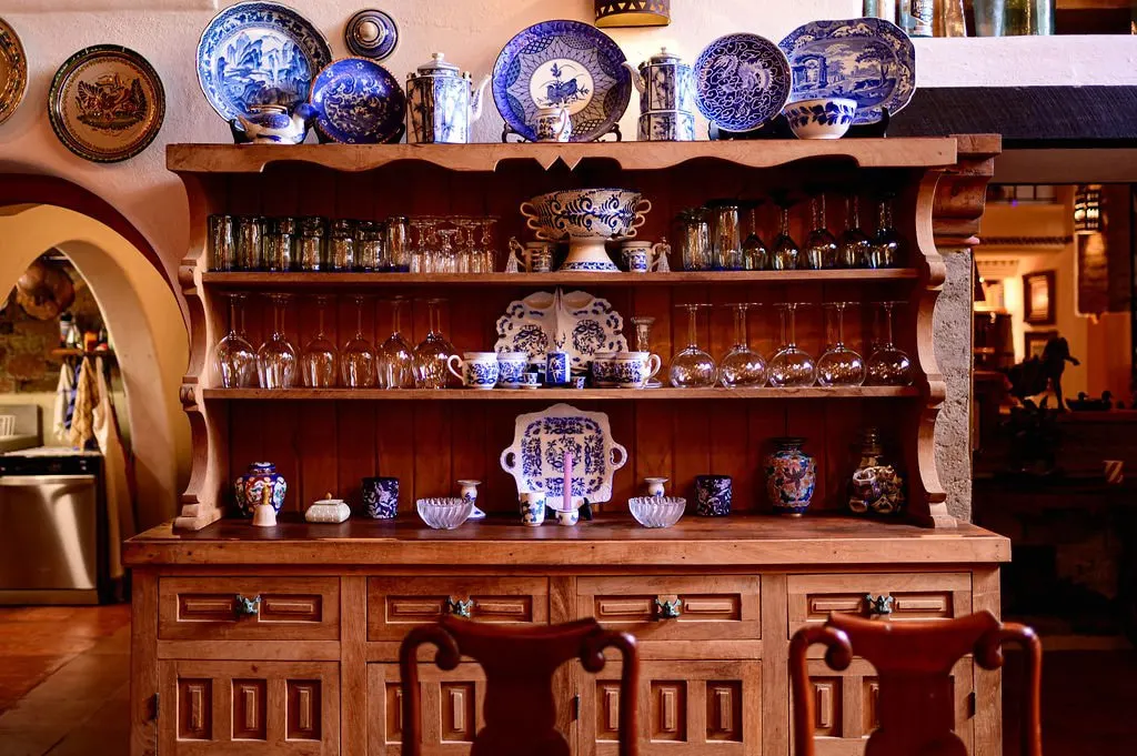Wooden dresser displaying blue-and-white Talavera plates